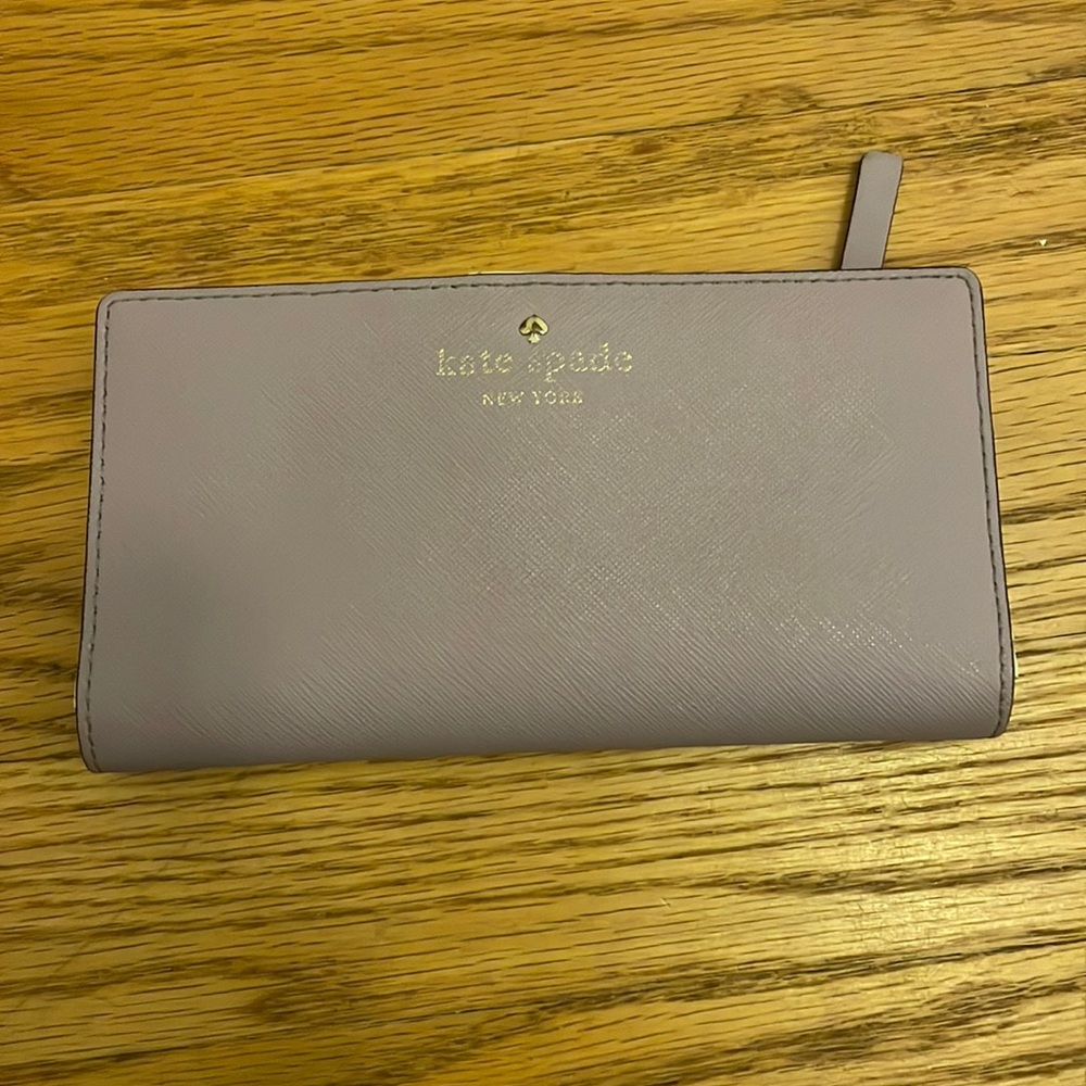 Kate spade lilac purple wallet. Normal wear and signs of use. Good condition